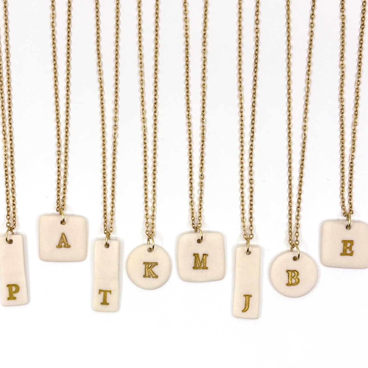 porcelain monogram charms in three shapes
