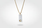 Gold Necklace with a white handmade porcelain pendant featuring a gold letter 'C'