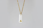 Gold Necklace with a white handmade porcelain pendant featuring a gold letter 'A'